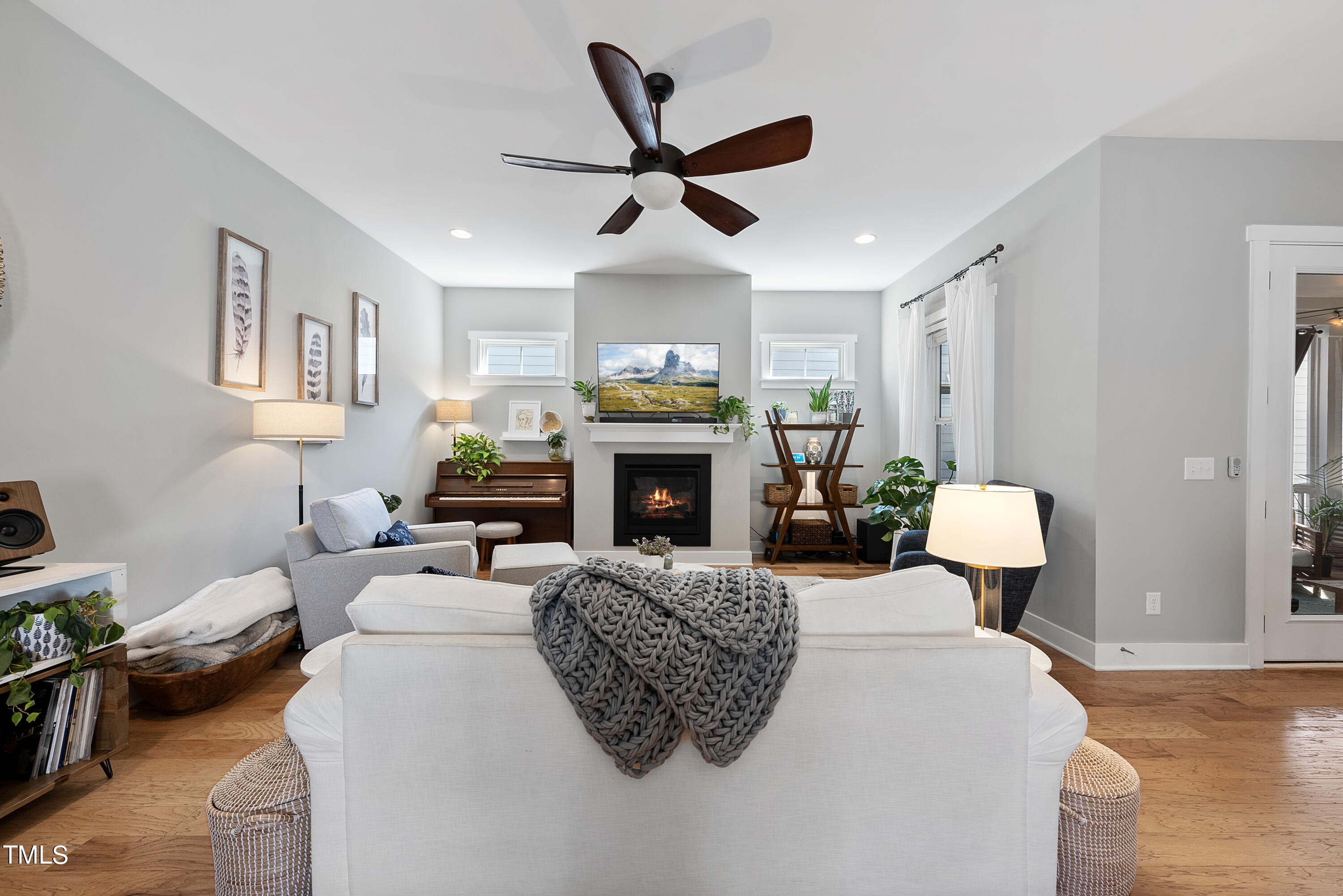 5205 Beckom Street Raleigh, NC 27616 - Photo 5 of 37 Gas burning fireplace provides cozy environment in living room