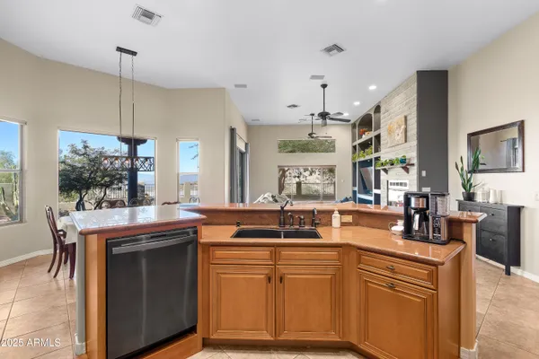 a living room with furniture ceiling fan and a fireplace