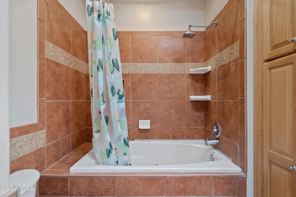 a view of a patio with table and chairs and potted plants