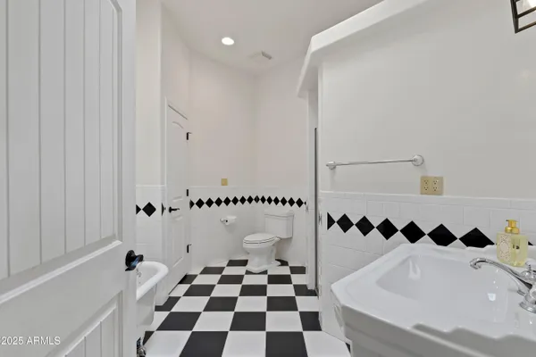 a view of a terrace with a table and chairs