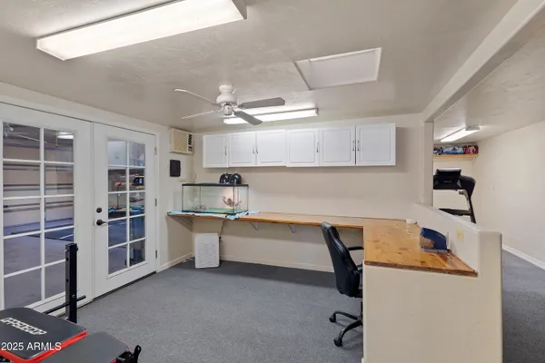 a view of a chair and tables in the balcony