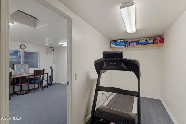 a front view of a house with basket ball court and outdoor seating