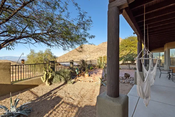 a view of a house with a yard and sitting area