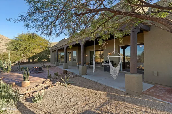 a view of a large mountain with mountains in the background