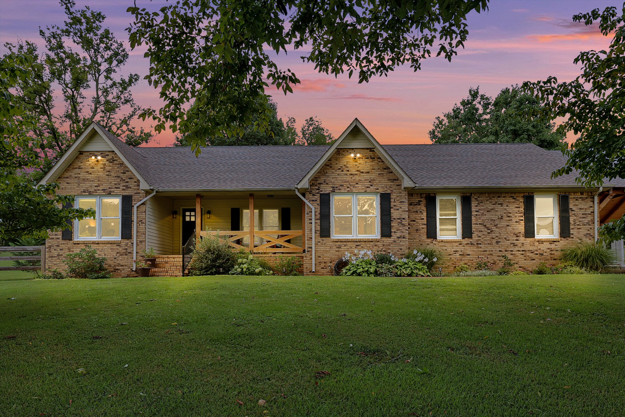1106 Rip Steele Road Columbia, TN 38401 - Photo 1 of 70 a front view of a house with a garden and trees