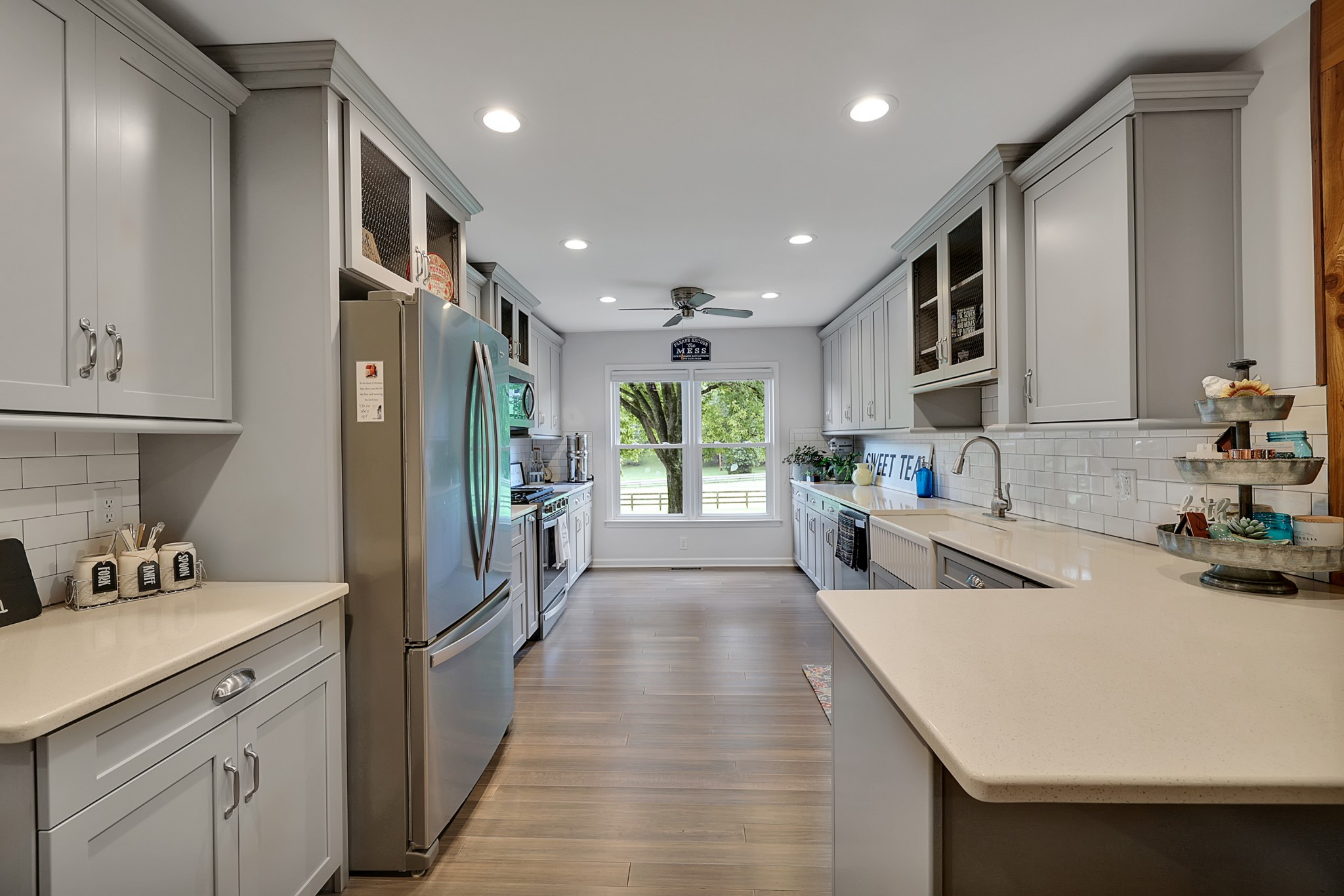 1106 Rip Steele Road Columbia, TN 38401 - Photo 11 of 70 a kitchen with counter top space a sink stainless steel appliances and cabinets