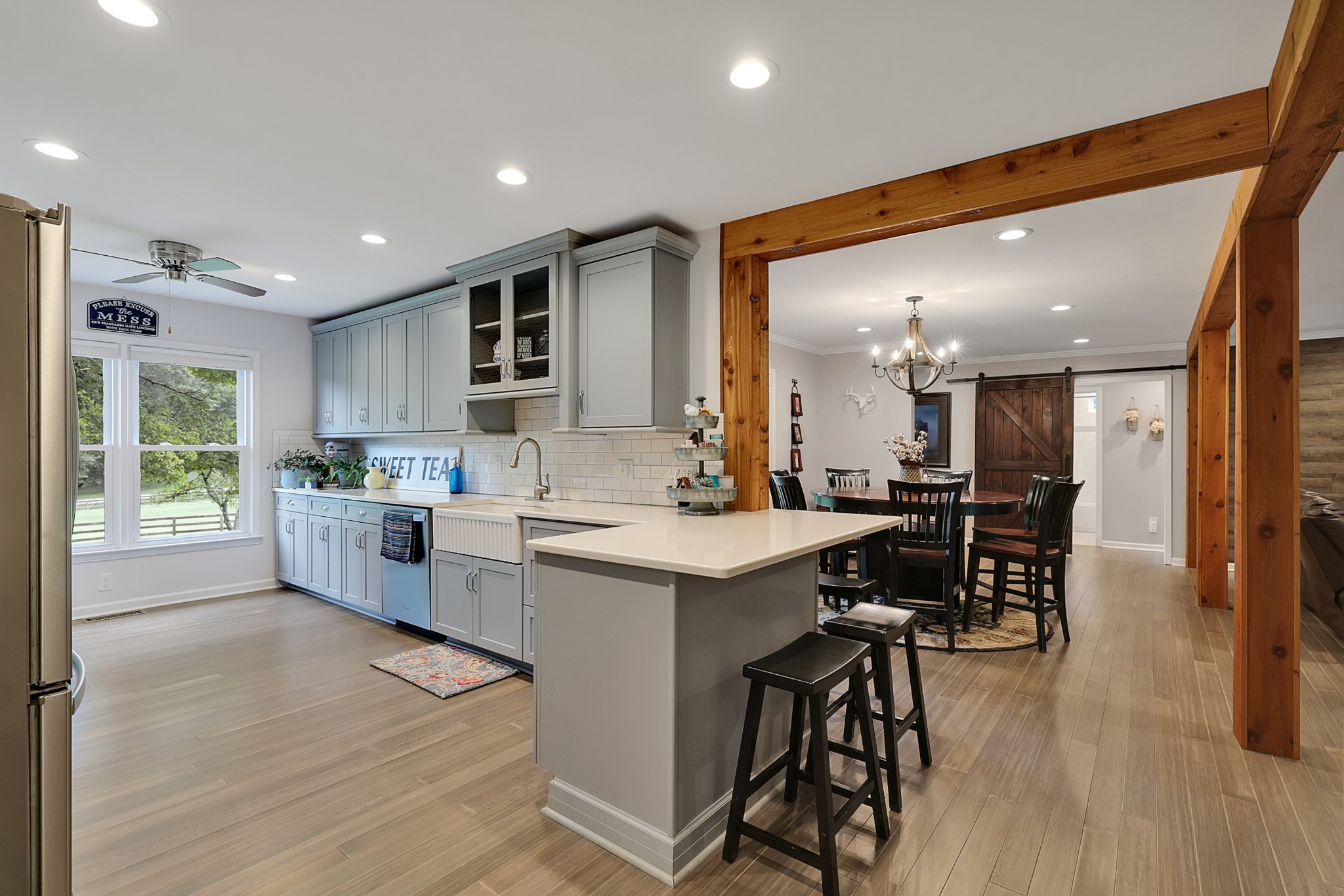 1106 Rip Steele Road Columbia, TN 38401 - Photo 13 of 70 a kitchen with white cabinets and chairs