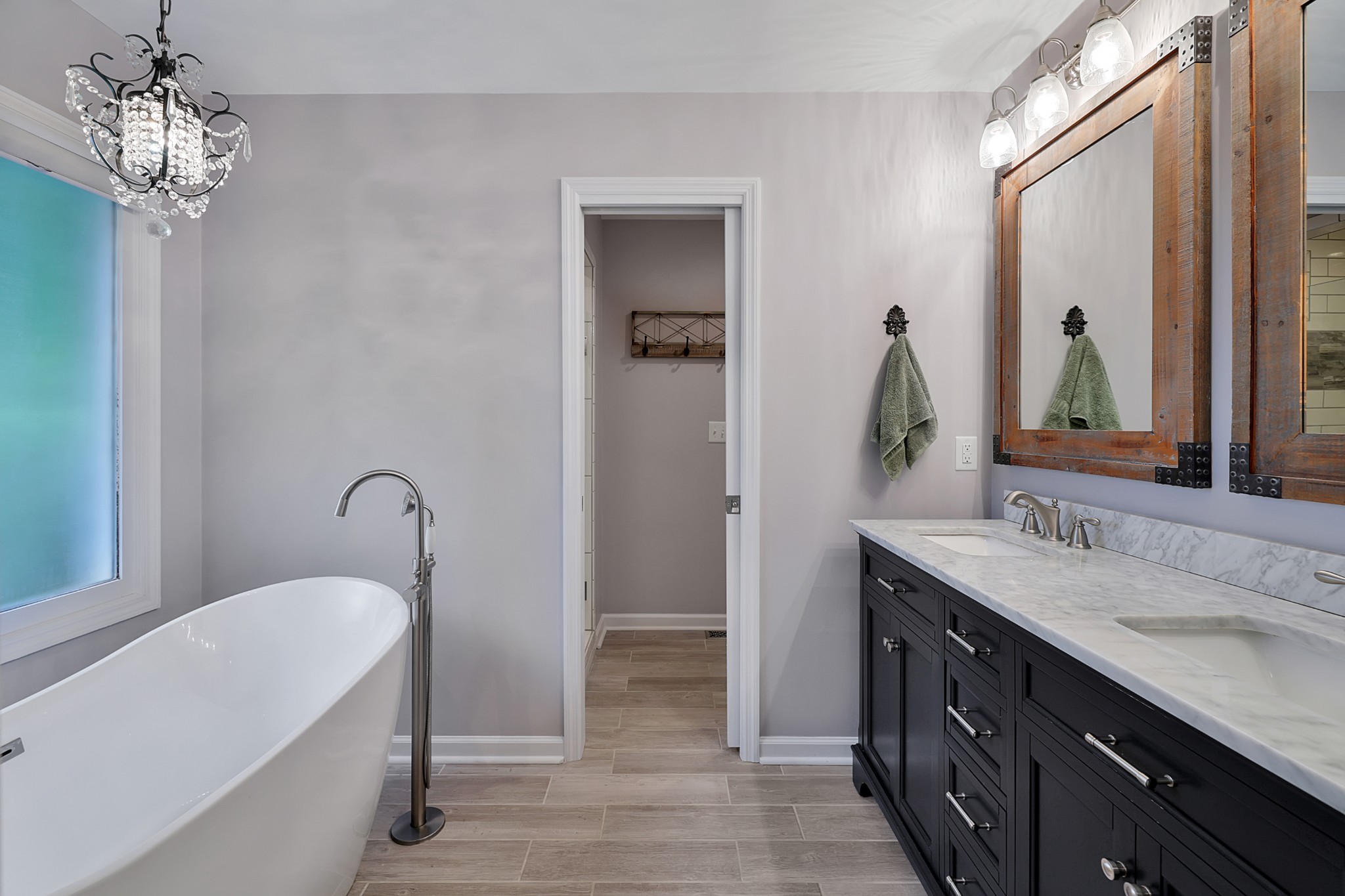 1106 Rip Steele Road Columbia, TN 38401 - Photo 21 of 70 a bathroom with a tub sink and mirror