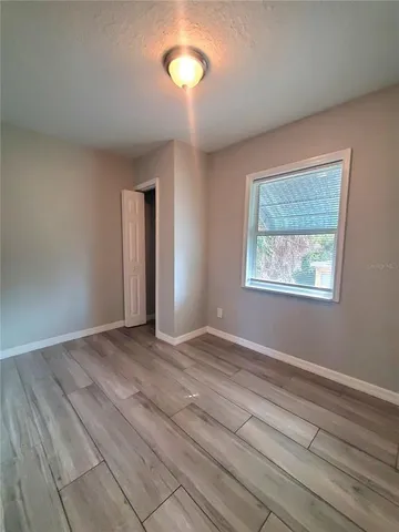 a view of an empty room with a window