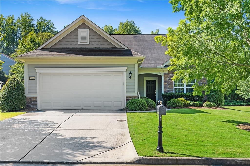 2988 Goldfinch Circle Marietta, GA 30066 - Photo 1 of 1 a front view of a house with garden