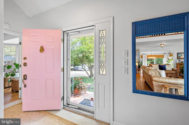 a kitchen with stainless steel appliances granite countertop a stove a sink dishwasher and cabinets with wooden floor