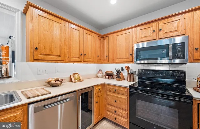 a bathroom with a granite countertop sink a toilet and a mirror