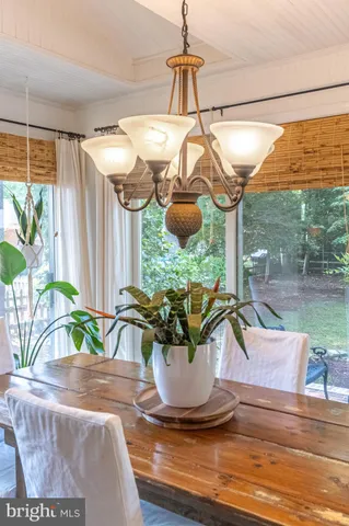 a view of a patio with a table and chairs under an umbrella
