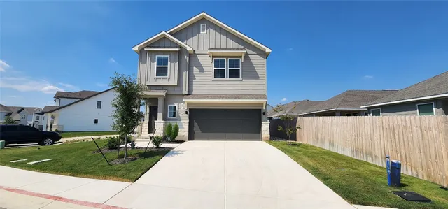 a front view of a house with yard