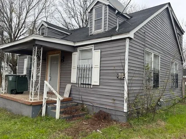 a front view of a house with a porch