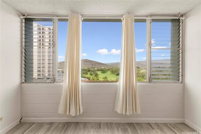 a view of kitchen and wooden floor