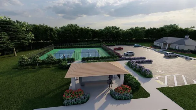 a aerial view of a house with pool garden and yard