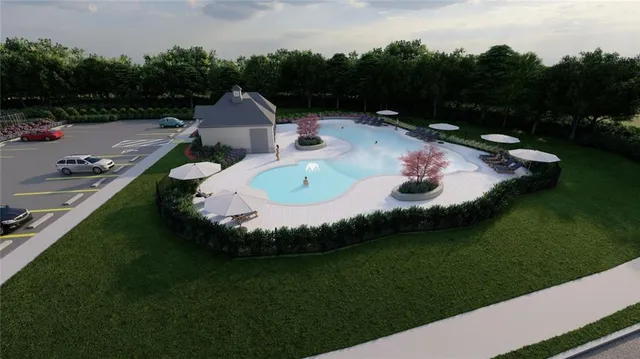 a view of a house with backyard and pool