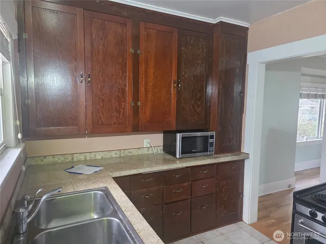 a kitchen with a sink and cabinets