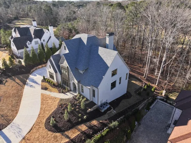 a view of a hallway with wooden floor and entryway