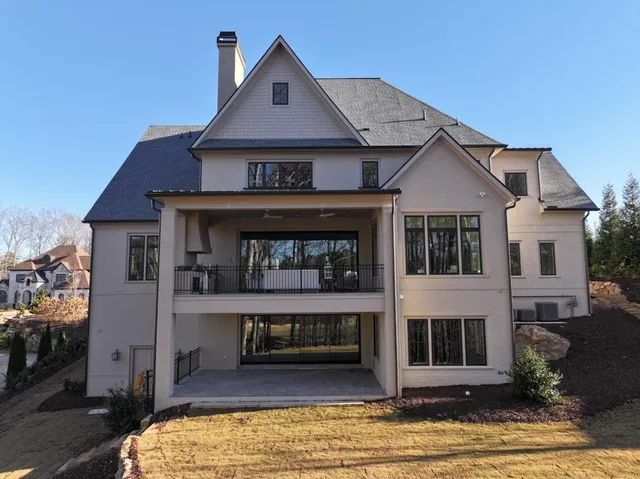 a view of a livingroom with furniture window and wooden floor