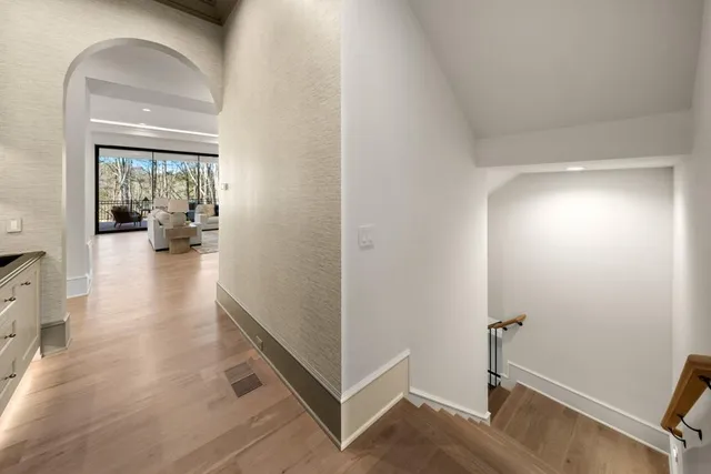 a bathroom with a glass shower door and a sink