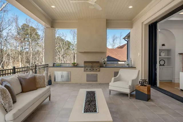 a view of an empty room with wooden floor and balcony