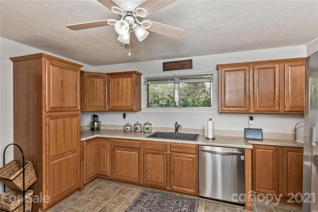127 Queentown Road Canton, NC 28716 - Photo 13 of 43 a kitchen with a sink cabinets and window