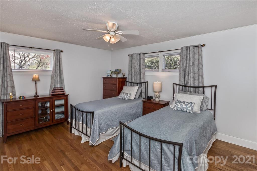 127 Queentown Road Canton, NC 28716 - Photo 17 of 43 a bedroom with furniture and a window