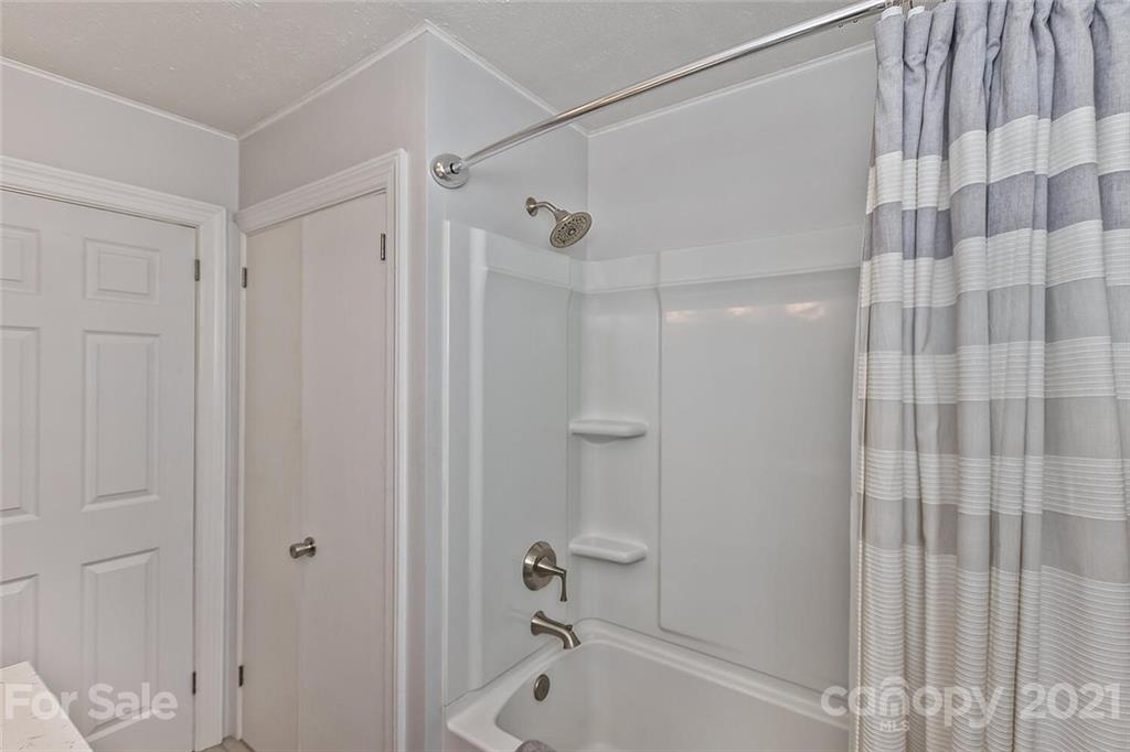 127 Queentown Road Canton, NC 28716 - Photo 20 of 43 a bathroom with a shower and a tub
