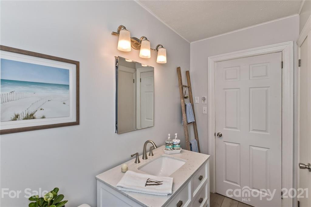 127 Queentown Road Canton, NC 28716 - Photo 21 of 43 a bathroom with a sink vanity and a mirror