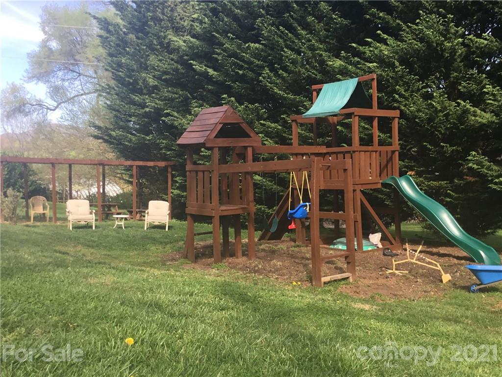 127 Queentown Road Canton, NC 28716 - Photo 42 of 43 a view of a wooden deck and a yard