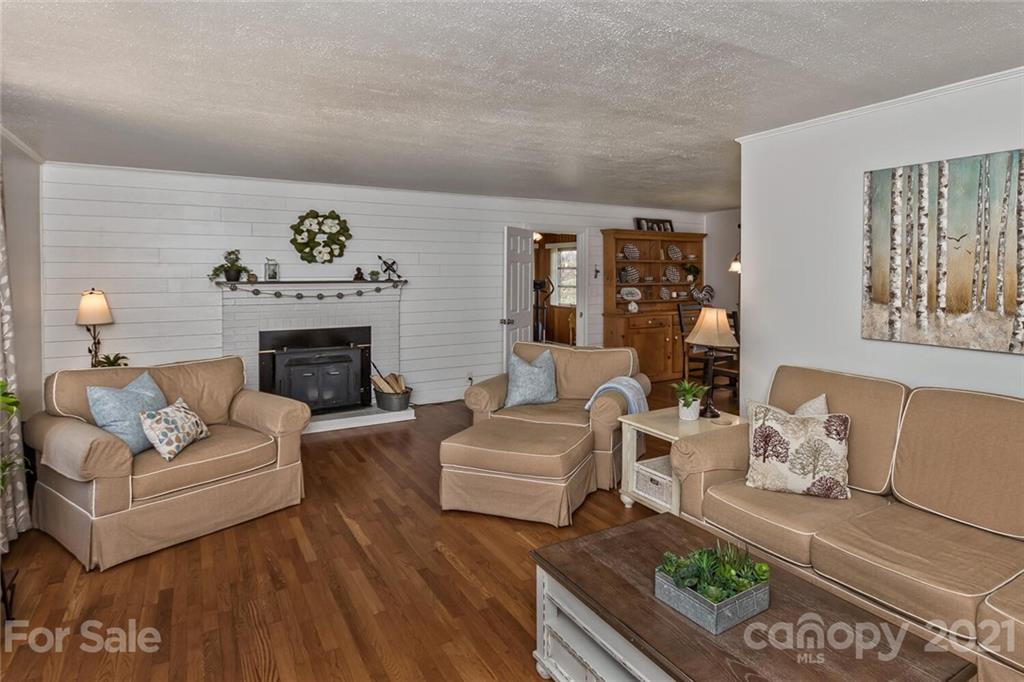 127 Queentown Road Canton, NC 28716 - Photo 6 of 43 a living room with furniture and a fireplace