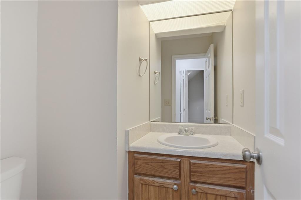2191 Phillips Road Lithonia, GA 30058 - Photo 15 of 41 a bathroom with a sink and a mirror