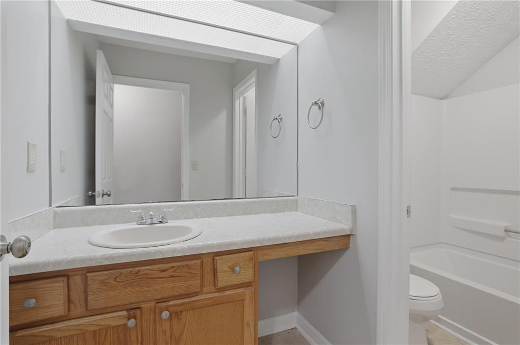 2191 Phillips Road Lithonia, GA 30058 - Photo 18 of 41 a bathroom with a sink and a mirror