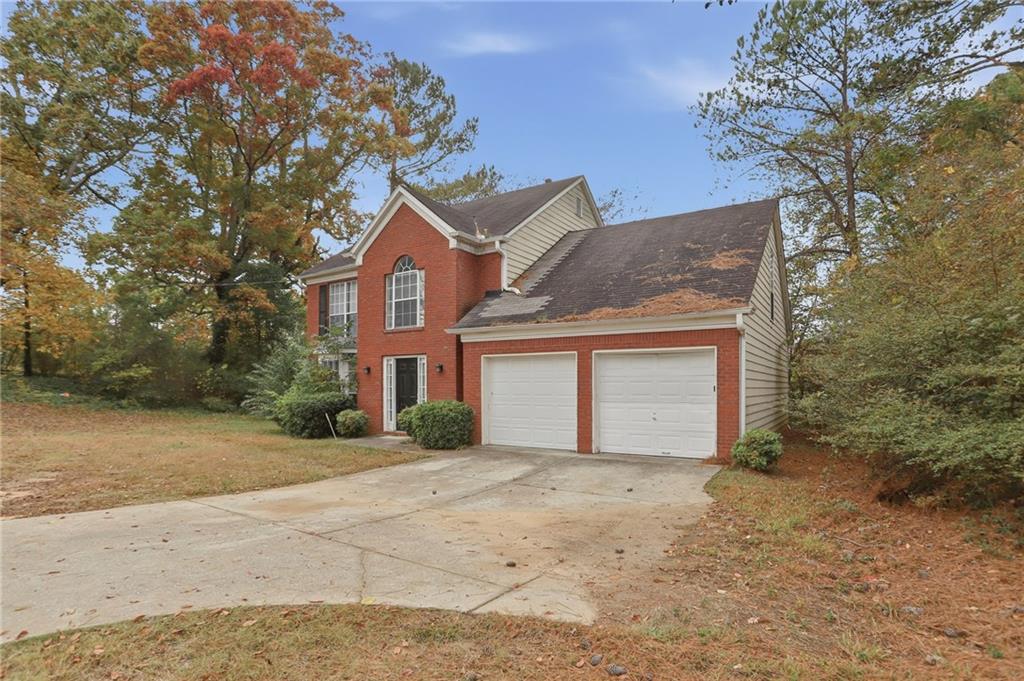 2191 Phillips Road Lithonia, GA 30058 - Photo 2 of 41 front view of a house with a yard