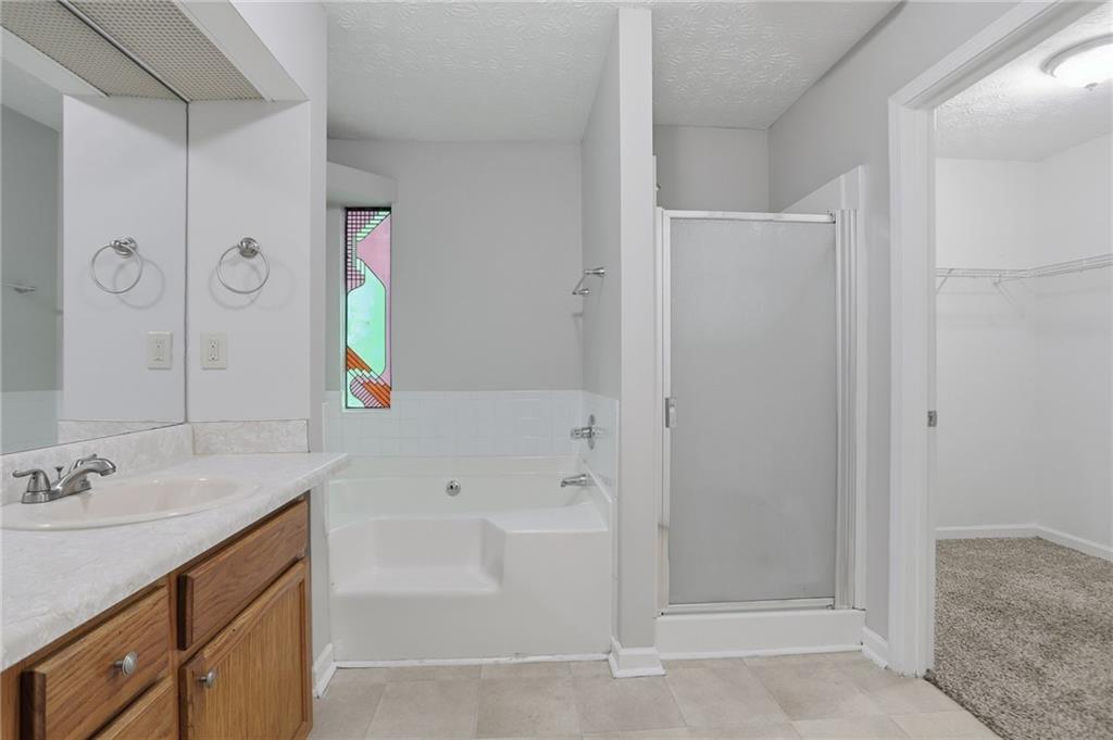 2191 Phillips Road Lithonia, GA 30058 - Photo 29 of 41 a bathroom with a tub sink and mirror