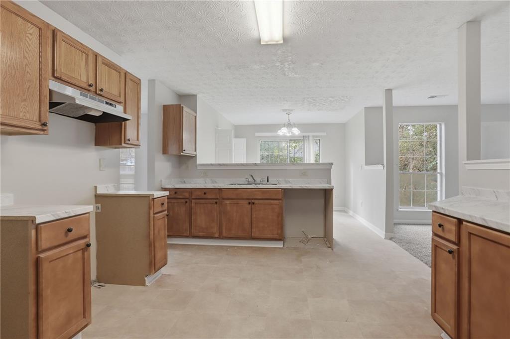 2191 Phillips Road Lithonia, GA 30058 - Photo 5 of 41 a kitchen with cabinets and window
