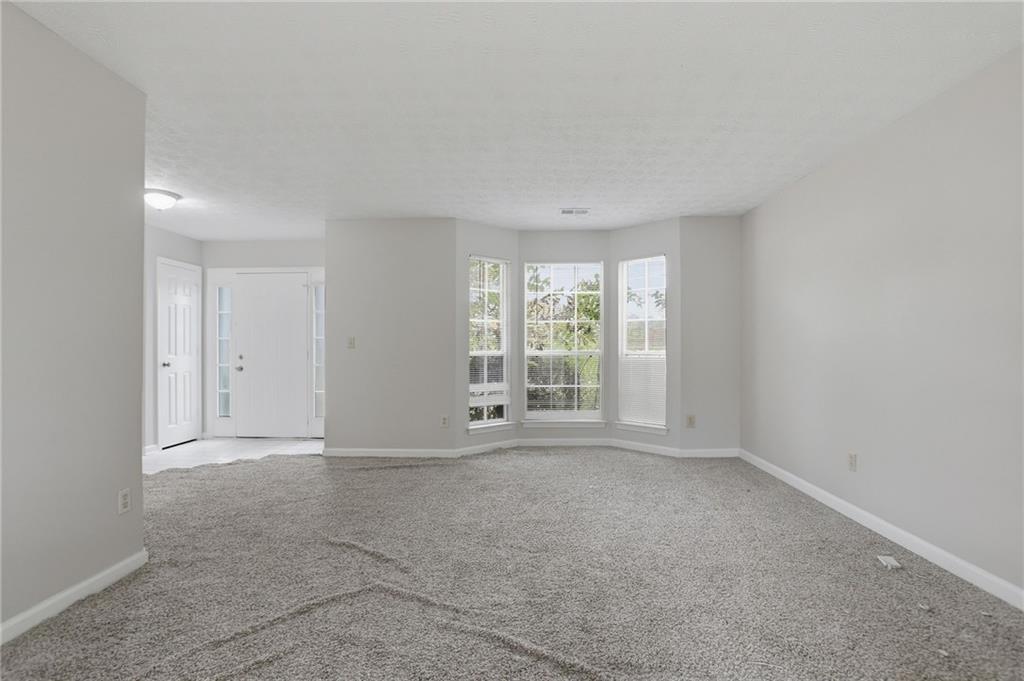 2191 Phillips Road Lithonia, GA 30058 - Photo 7 of 41 a view of an empty room with a window