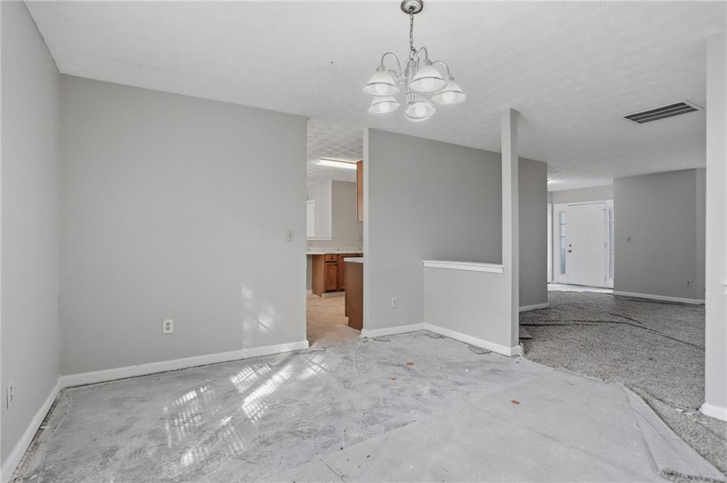 2191 Phillips Road Lithonia, GA 30058 - Photo 10 of 41 a view of a big room with chandelier and chandelier