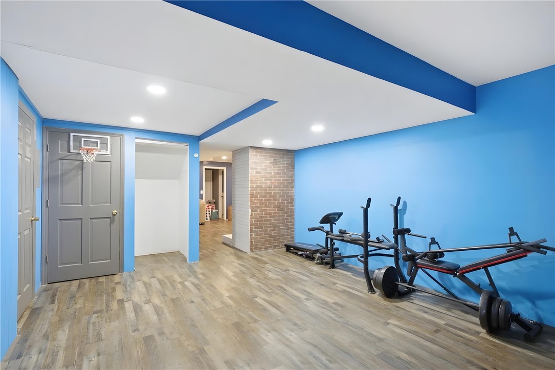 311 Cumberland Way Anderson, SC 29621 - Photo 32 of 44 A well-lit recreational space offers ample room for fitness equipment and activities.