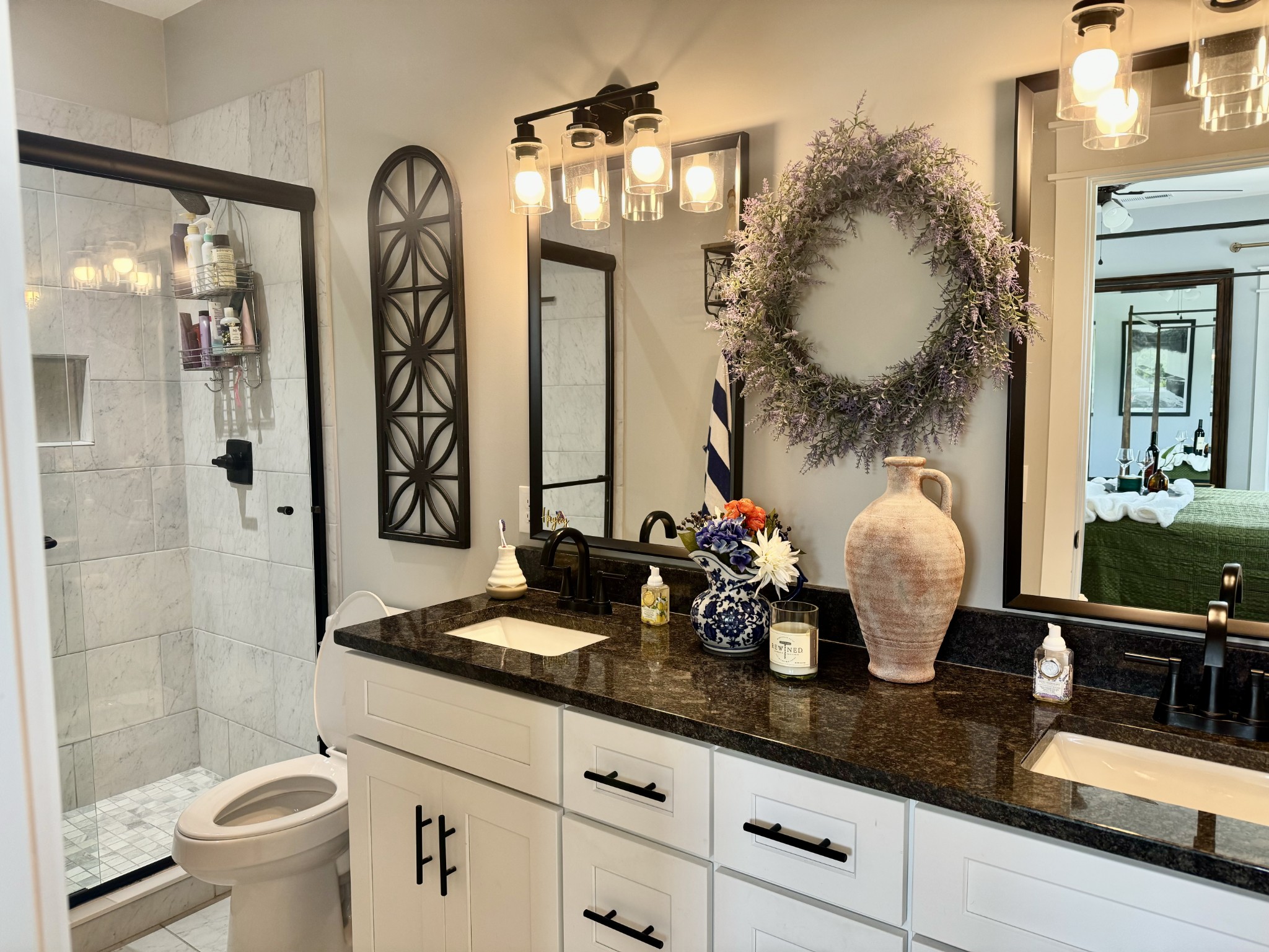 172 Tenpenny Road Morrison, TN 37357 - Photo 12 of 27 a bathroom with double vanity sinks a toilet and a mirror