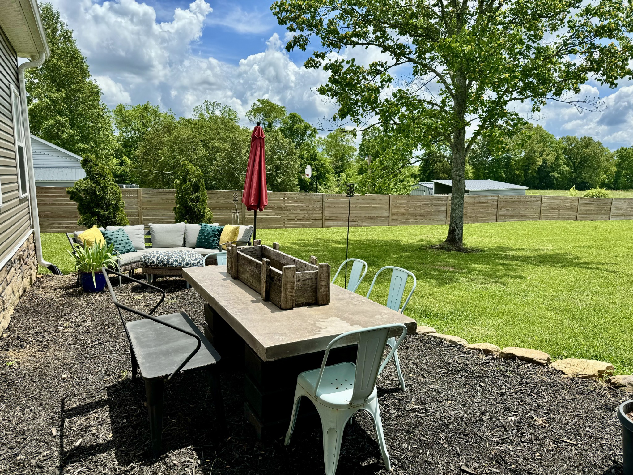 172 Tenpenny Road Morrison, TN 37357 - Photo 18 of 27 a view of a backyard with furniture and a garden