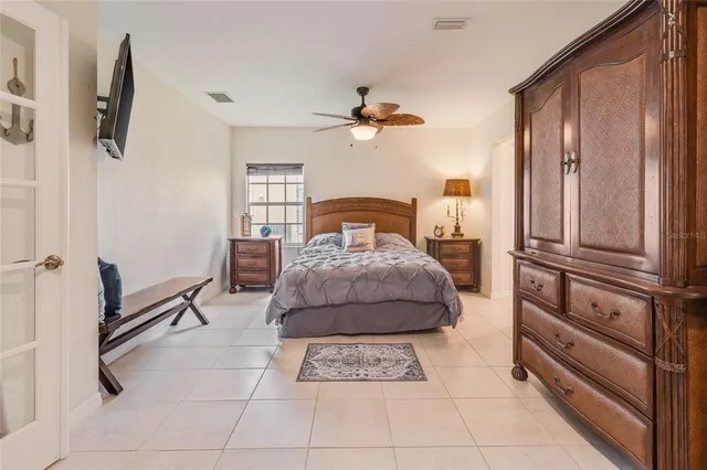 a bedroom with a bed a rug and dresser