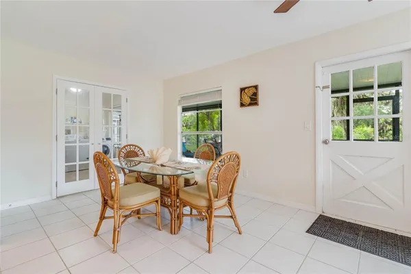 a view of a dining room with furniture and window