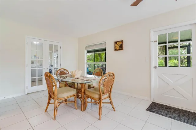 a view of a dining room with furniture and window