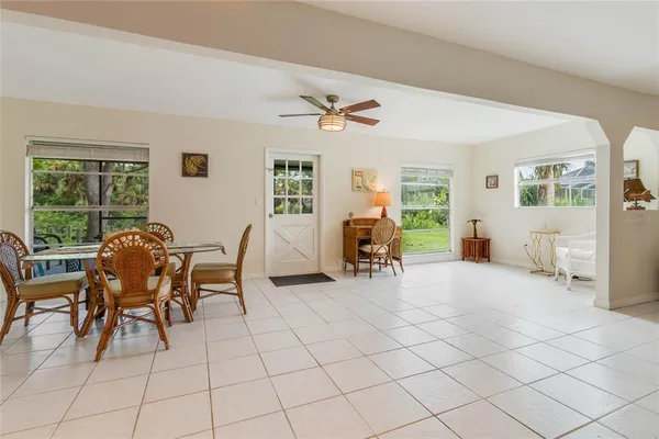 a view of a livingroom with furniture and a window