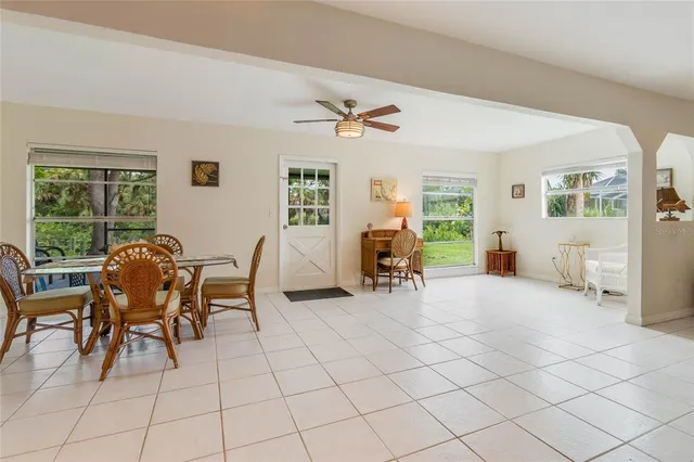 a view of a livingroom with furniture and a window