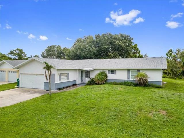 a view of a house with a back yard