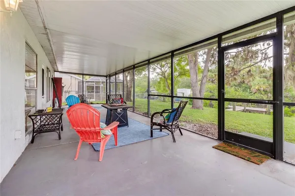 a view of a room with chairs and lounge chairs